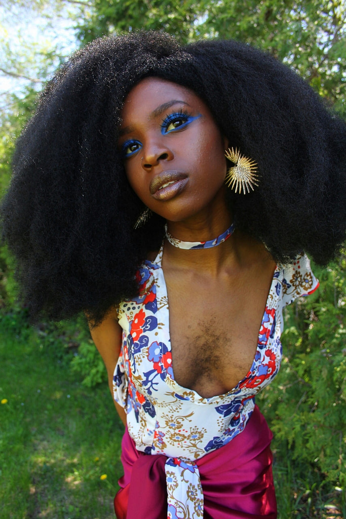 Esther Queen Esie Calixte-Bea on Embracing Black Beauty and Pushing  Against Societal Ideals